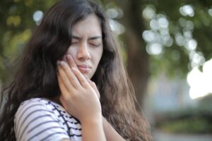 shallow focus photo of woman in white and black stripe shirt